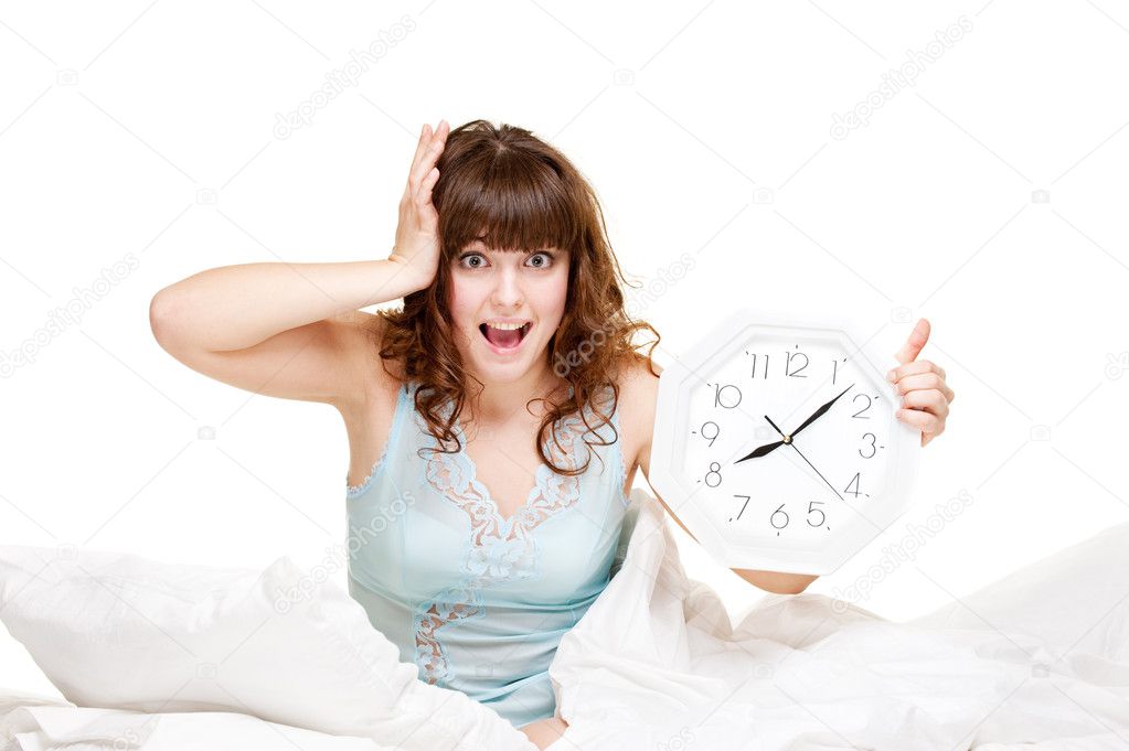 Young woman with clock in panic