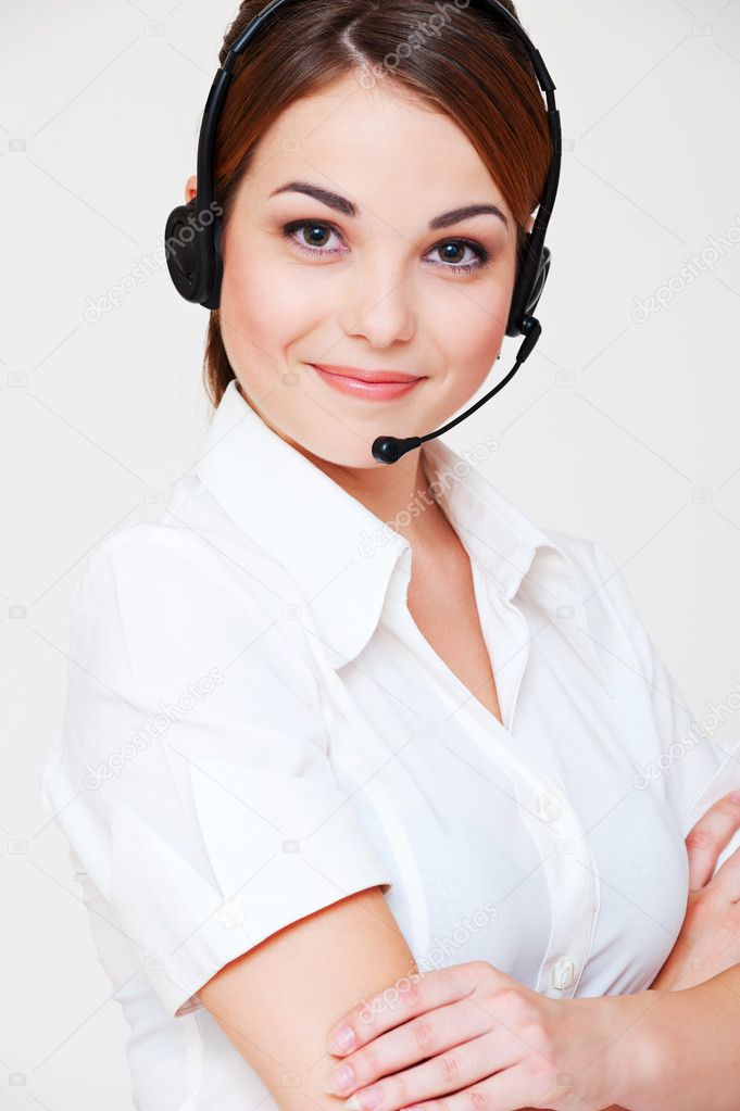 Friendly telephone operator over grey background