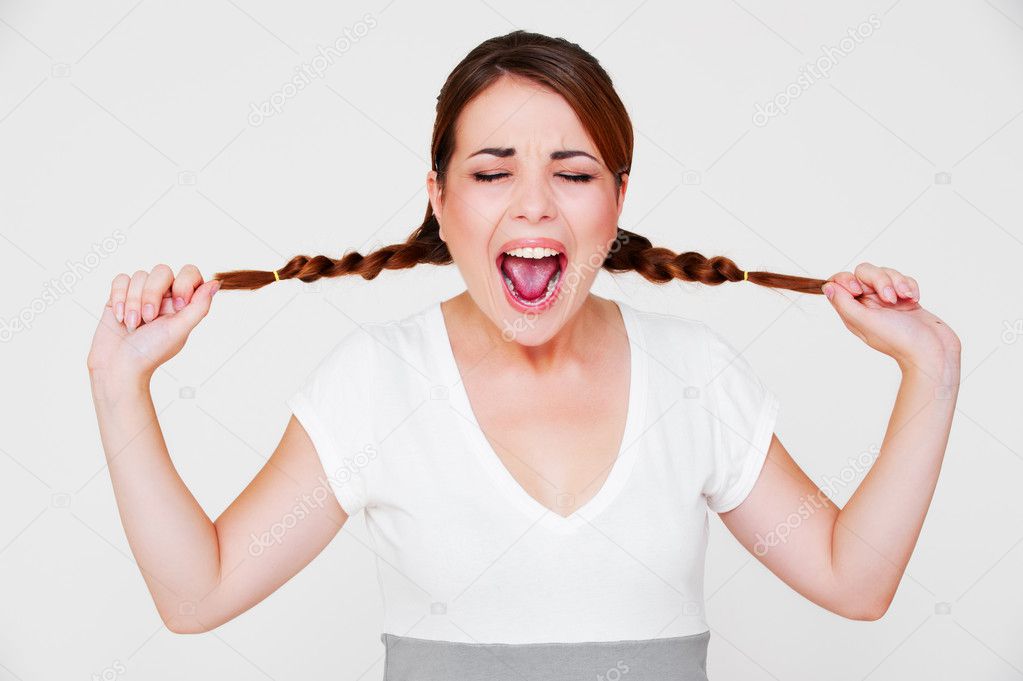 Funny screaming girl with two pigtails