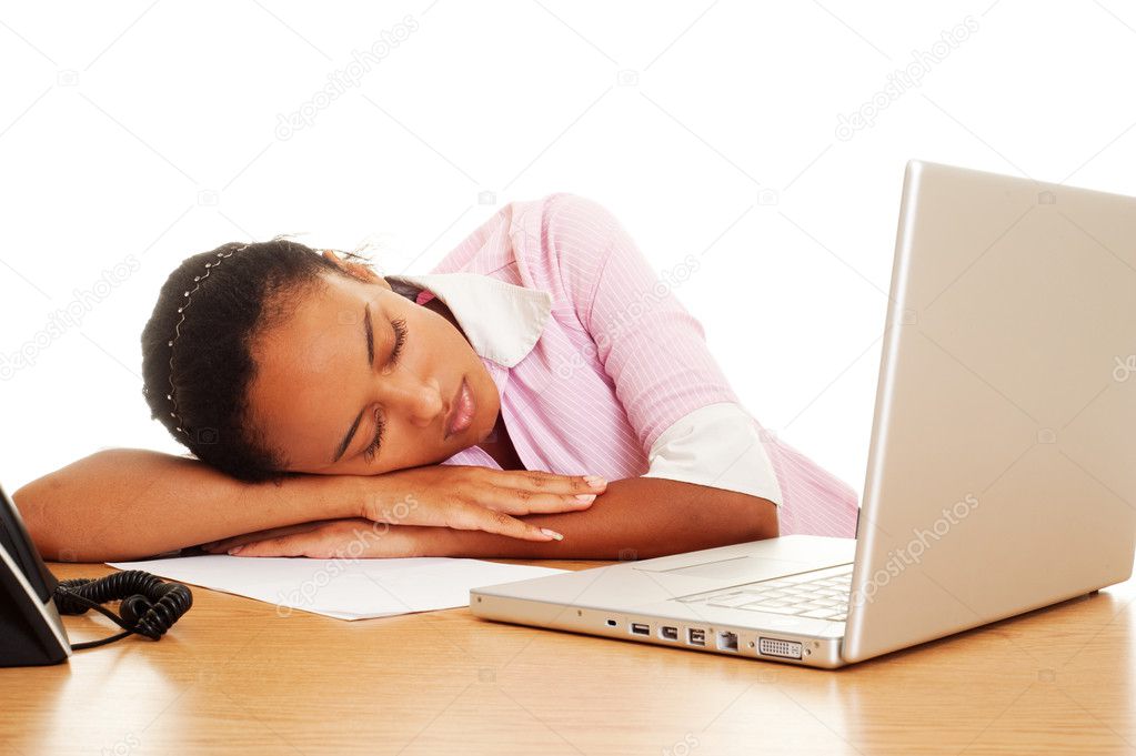 Tired woman sleeping at the workplace