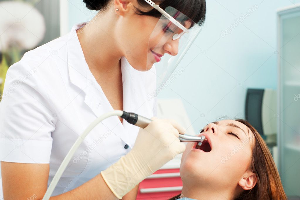 Smiley dentist and patient