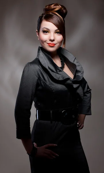 Beautiful woman in dark dress — Stock Photo, Image