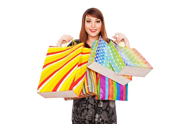 Parlak alışveriş torbaları ile mutlu bir kadın — Stok fotoğraf