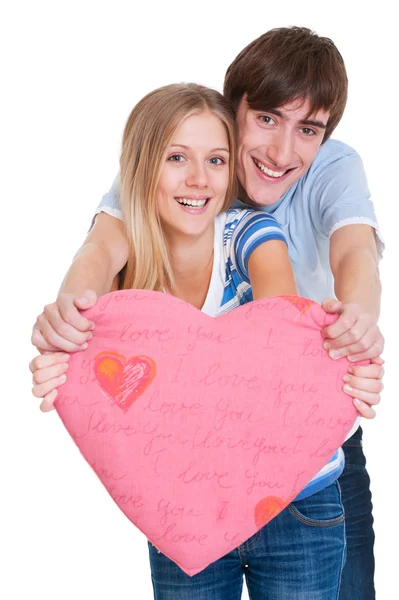 Happy young couple with pink heart — Stock Photo, Image