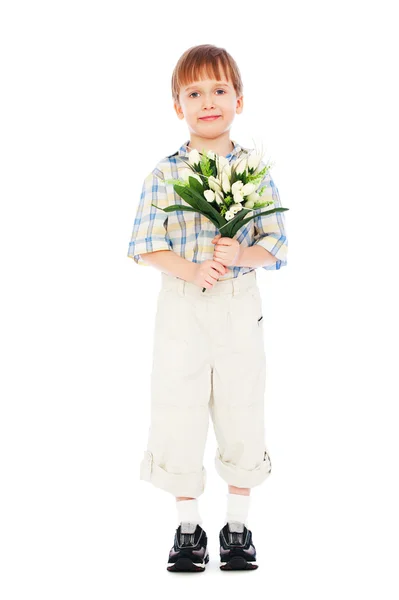 Liten pojke håller massa tulpaner — Stockfoto