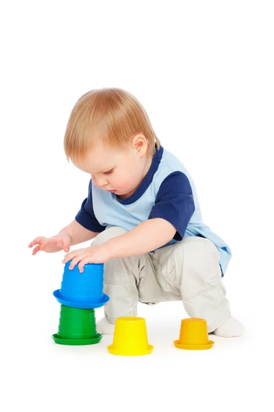 Menino brincando com brinquedos — Fotografia de Stock