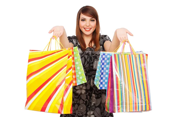 Hübsche Frau mit hellen Einkaufstaschen — Stockfoto