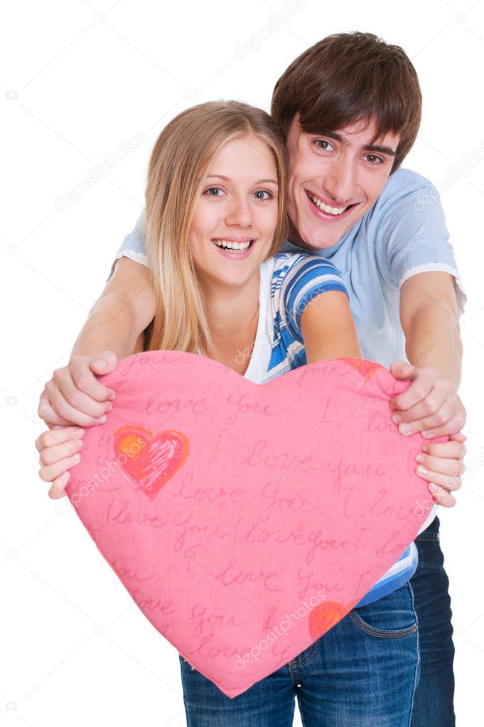 Happy young couple with pink heart