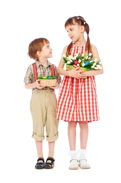 Smiley boy and girl with easter gifts — Stock Photo, Image