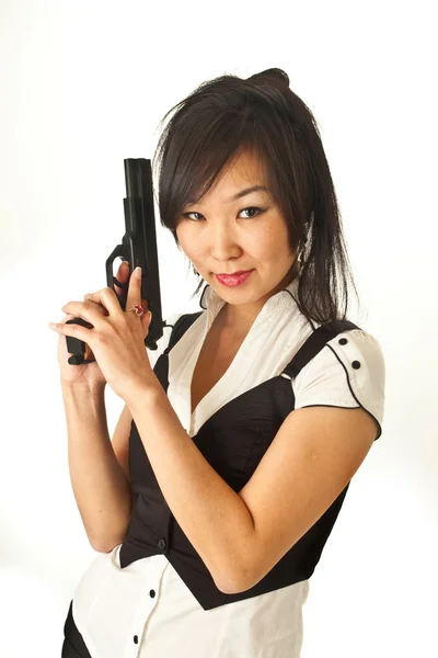 The Asian girl with a handgun — Stock Photo, Image