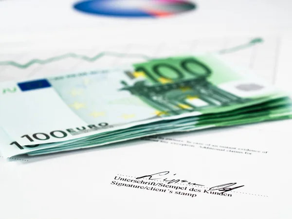 One Hundred Euros with Statistics Royalty Free Stock Photos