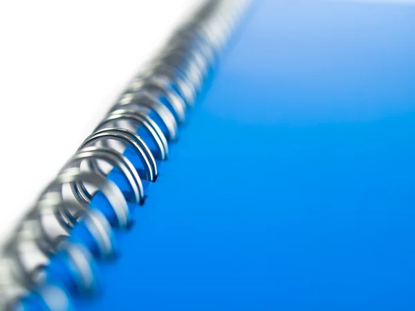 Stock image Isolated blue folder with metal spiral binding