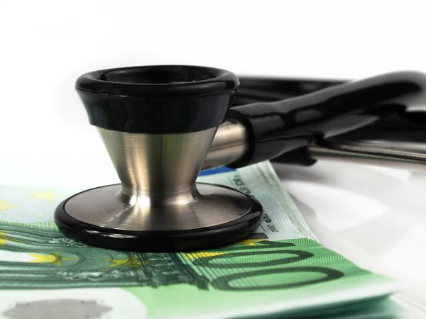 Medical instrument with money Royalty Free Stock Photos