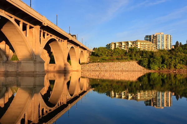 Bridge relecting in calm River — Stock Photo, Image