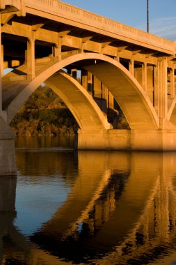 Bridge reflecting in the Fall Colors clipart