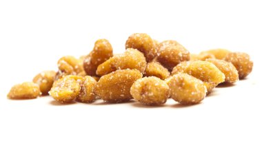 Closeup of sugar peanuts on a white background clipart