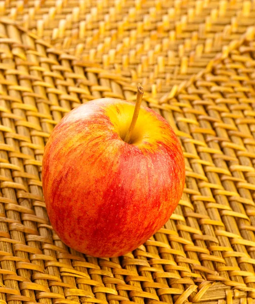 Apple on wicker — Stock Photo, Image