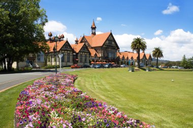 Rotorua museum - historic bathhouse in New Zealand's thermal waters region. Geothermal spa building. clipart