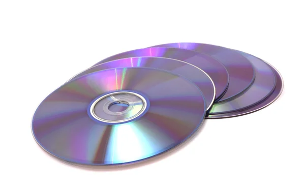 Algunos DVDS de discos se extienden sobre un fondo blanco Imagen de archivo