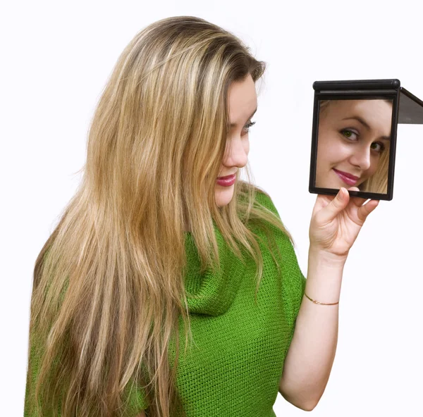 Looks in a mirror — Stock Photo, Image