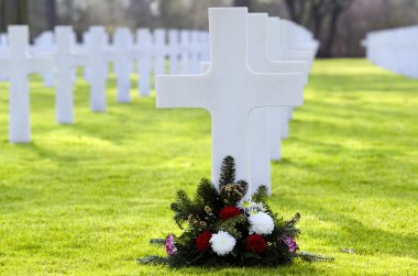 A cross with no name,in a cimetery of the second mondial war clipart