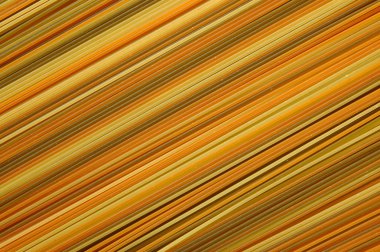 Texture of the various colours of spaghetti clipart