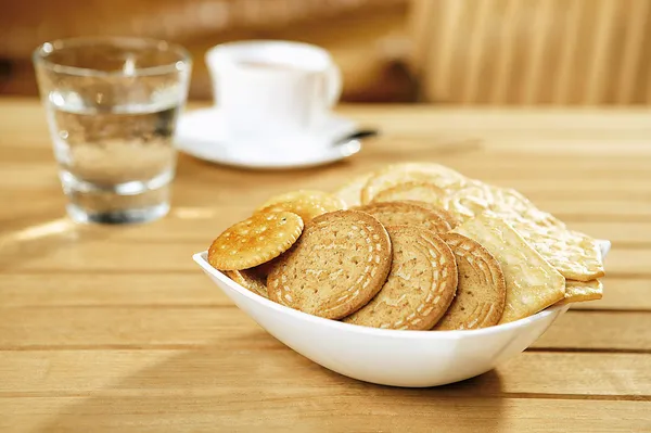 Crackers on a wooden table — Stock Photo, Image