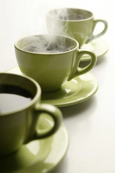 Three Steaming Mugs Row Green Colors — Stock Photo, Image