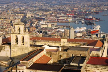 View of the Naples port and castle bell tower during the sunset. clipart