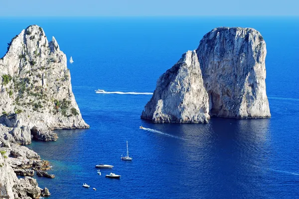 stock image Faraglioni rocks close the Capri island in Italy with a beautiful blue sea color.