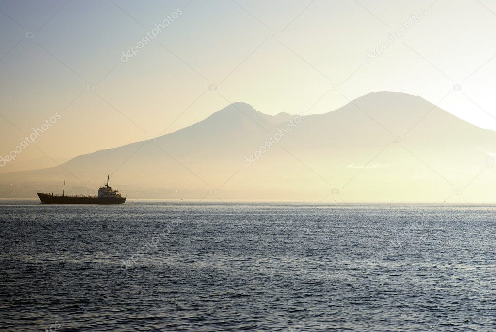 Ferry on a sea with Mount Vesuvius in background
