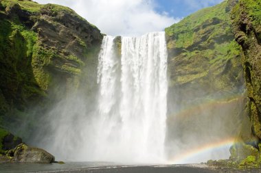 Skogarfoss on the Iceland with a rainbow clipart