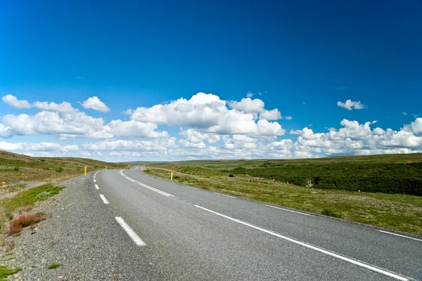 stock image Empty road with a beautiful blue sky in horizon