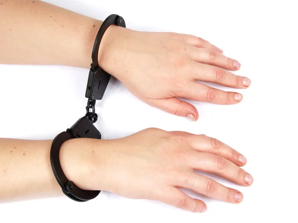 Feminine hands shackled in manacles — Stock Photo, Image