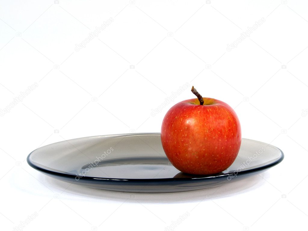 Apple on plate — Stock Photo © koltashev #4980084