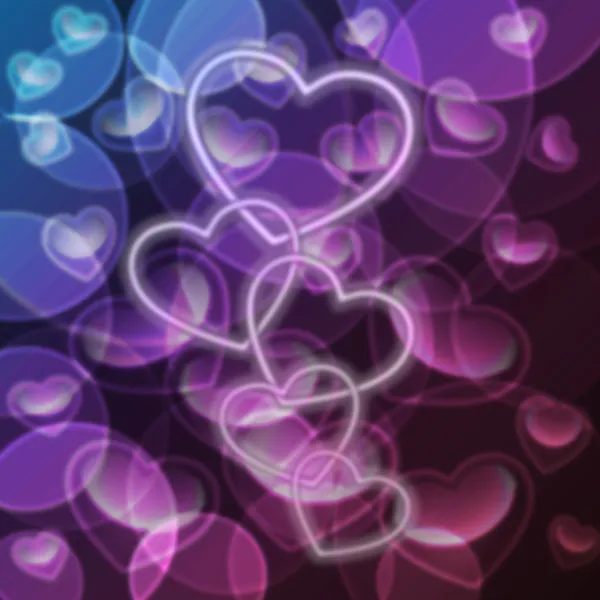 Bright colorful abstract bokeh heart shapes — Stock Photo, Image