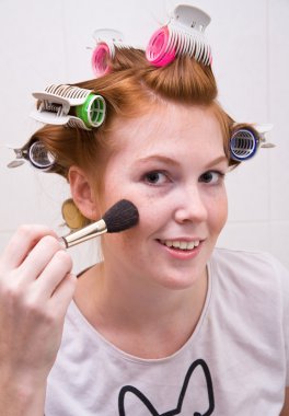 Redhead teen girl doing makeup clipart