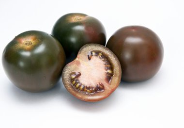 Black tomato Kumato. clipart