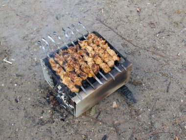 Barbeque on a sand clipart