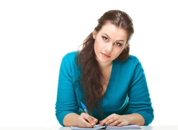 Young women writing in the exercise book — Stock Photo, Image