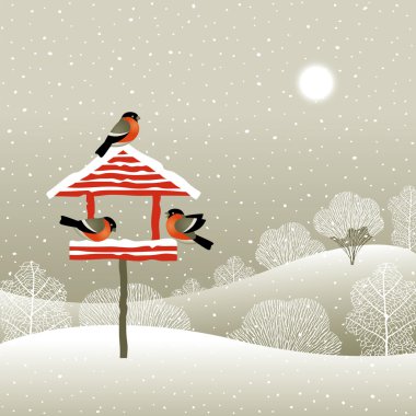 Birdfeeder in winter forest clipart