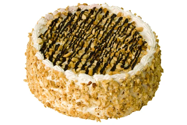 Piškotový dort s arašídy na bílém pozadí — Stock fotografie