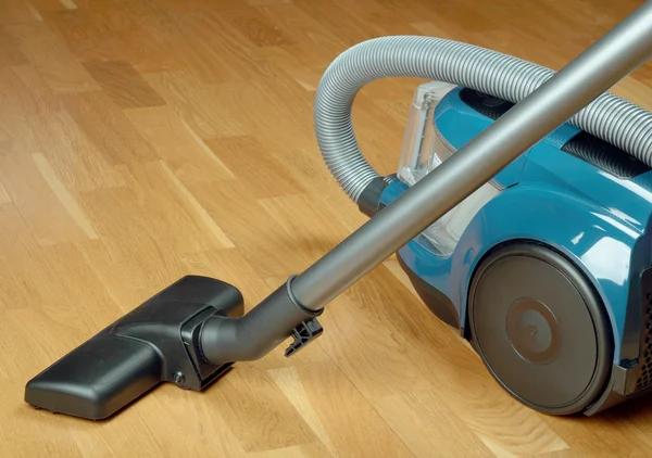 Vacuum cleaner on a oak parquet — Stock Photo, Image