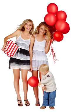 Two girls and a little boy with balloons. clipart