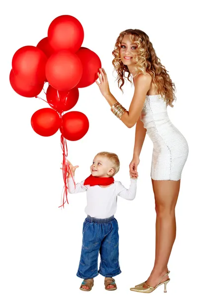 Frau und kleiner Junge mit roten Luftballons — Stockfoto