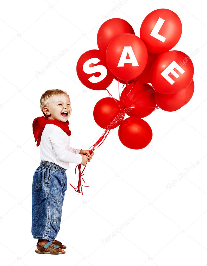 Cute little boy in white shirt, jeans and red scarf