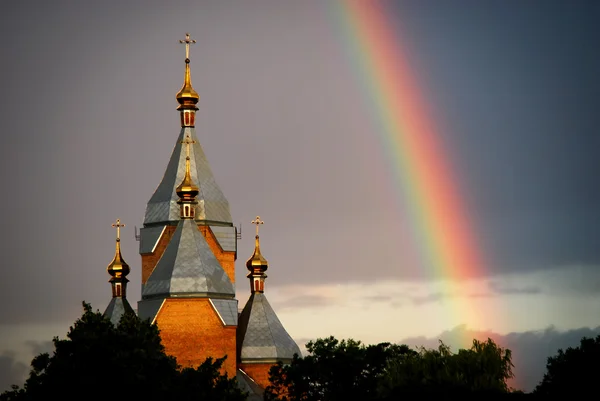 Chiesa e arcobaleno Foto Stock