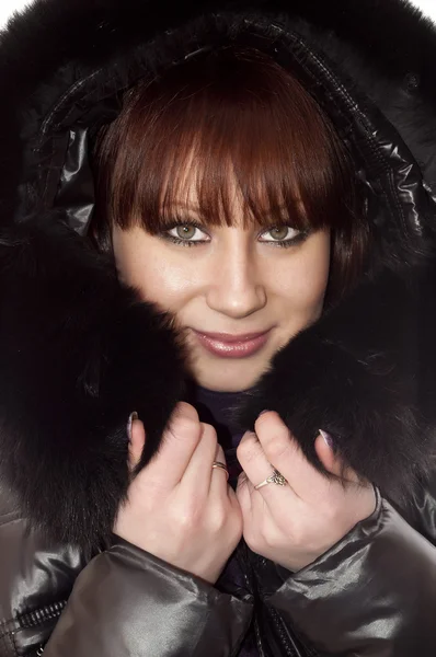 Vrouw in winter jas Stockfoto
