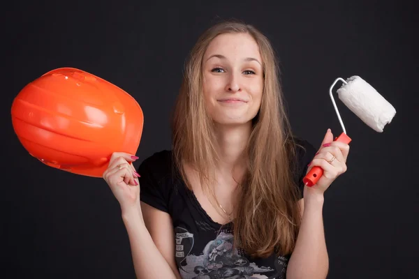 Girl holding a helmet and roller — Stock Photo, Image