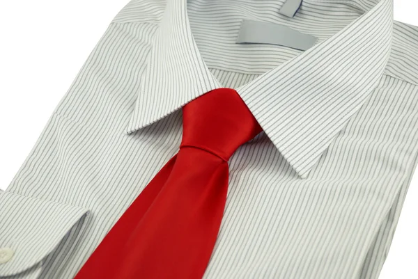 New striped shirt with red silk necktie over white — Stock Photo, Image